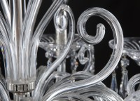 Detail of a flame-shaped glass arm