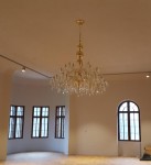Large golden crystal chandelier in the interior of Bojnice castle Slovakia