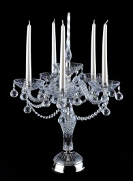 large crystal candlestick on a table made of silver metal and crystal glass