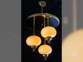 Lighted Art deco chandelier with three white balls