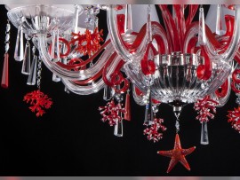 Detail of ruby coral and sea starfish from below chandelier