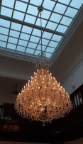 View of the interior of the villa with a large crystal chandelier