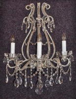 The 3-arms crystal wall light with cut pearls