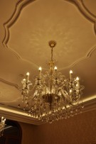 Luxury crystal chandelier in the old stone building