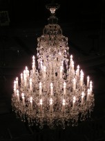 A large Terezin chandelier is lit.