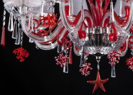 Detail of ruby coral and sea starfish from below chandelier