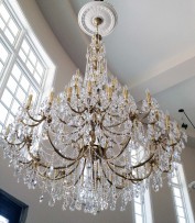 The 65 large cats brass chandelier in interior