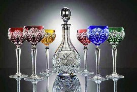Set of colored hand cut wine glasses and the crystal carafe