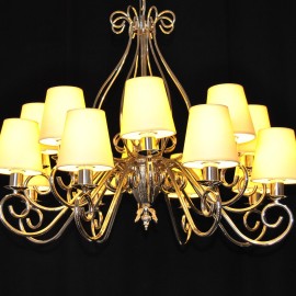 The custom-made silver tubular chandelier with white lampshades