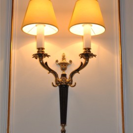 Various wall lights made of cast brass