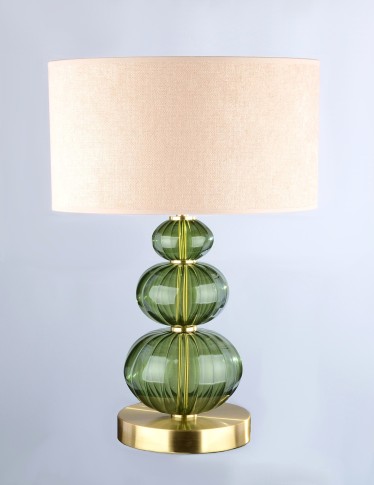 Une lampe de table discrète en verre vert foncé de la couleur d'une étoile tombée (Moldavite).