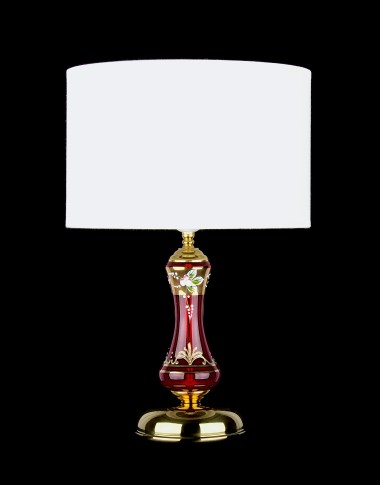 Lampe avec un abat-jour cylindrique en tissu et un socle en verre rubis