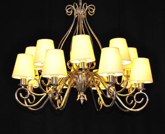 The custom-made silver tubular chandelier with yellow 12 lampshades